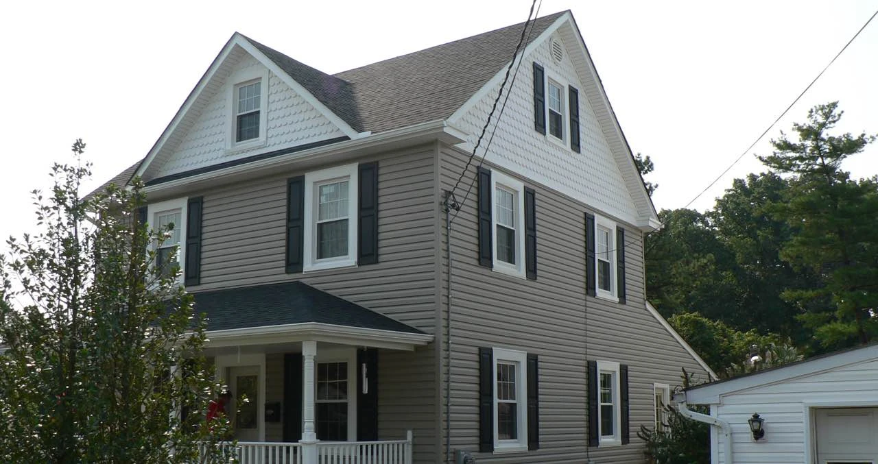 After: same house with new siding