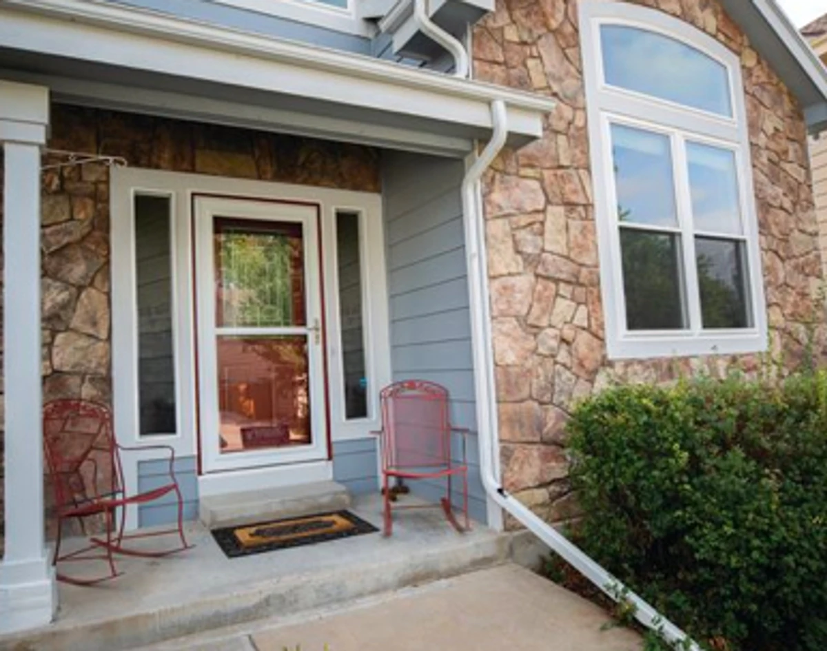 Exterior view: storm door with sidelites.