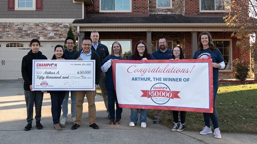 Champion contest winners with check