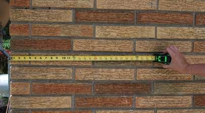 Champion installer making measurements