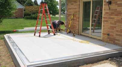 Champion installer working on first steps of a sunroom