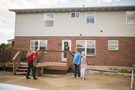 Champion employee showing customers options