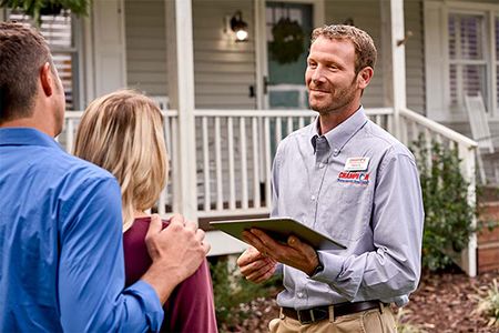 Champion employee talking with customers