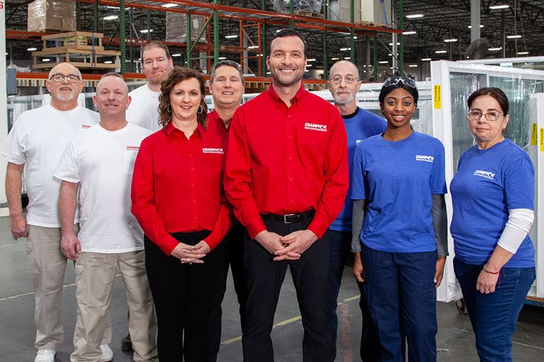 Champion employee talking with customers