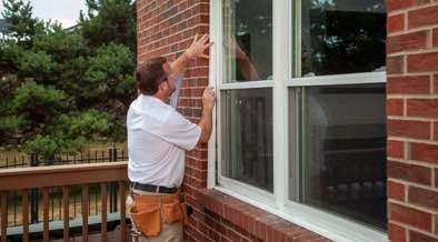 Champion installer sealing the edges of a window