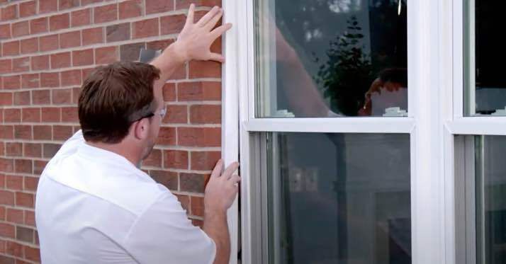 Champion installer working on window