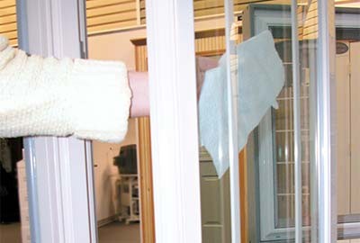 Person cleaning outside of window