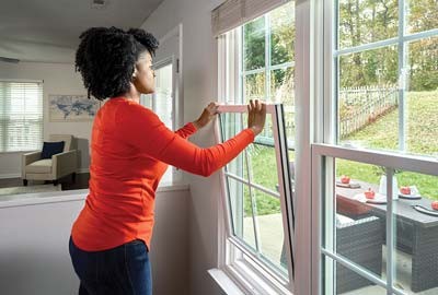Person returning window sashes to starting position