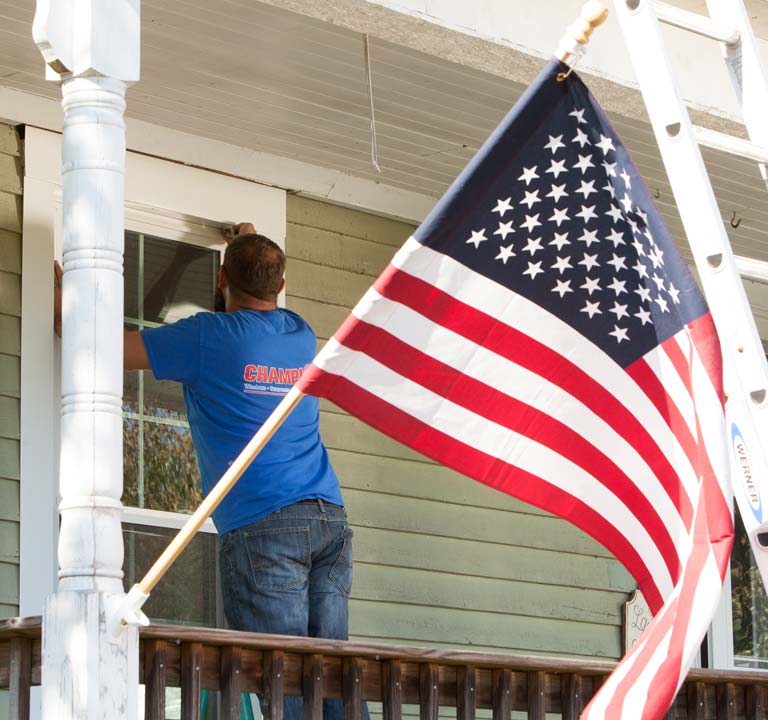 Photo of Champion Installer working on window