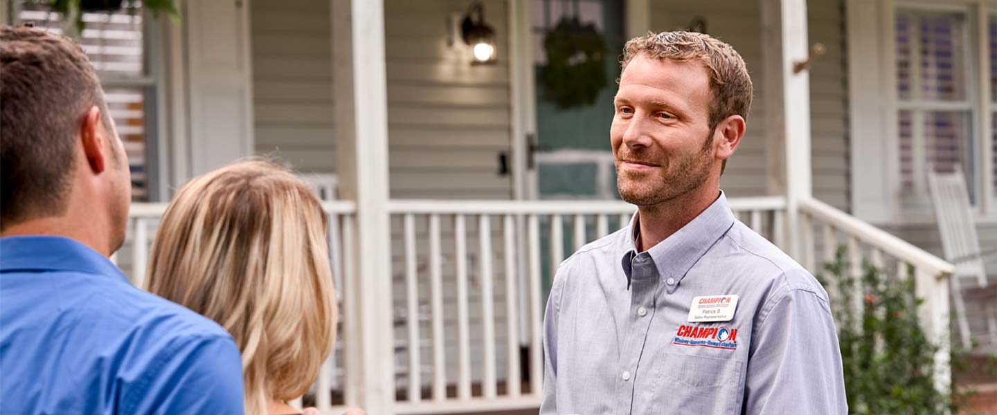 Champion Windows employee talking with customers